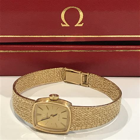 omega solid gold ladies watch.